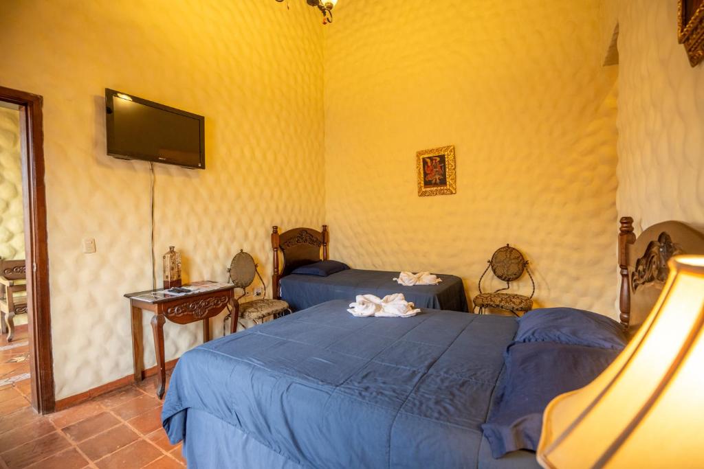 Ένα ή περισσότερα κρεβάτια σε δωμάτιο στο Hotel Caxa Real