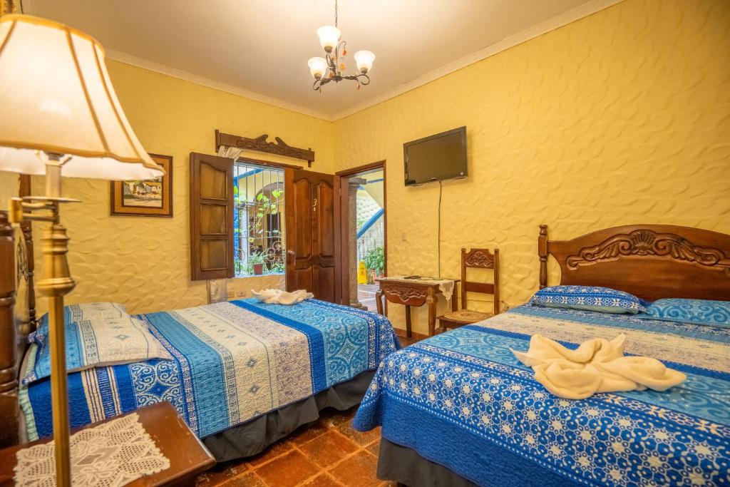 Ένα ή περισσότερα κρεβάτια σε δωμάτιο στο Hotel Caxa Real
