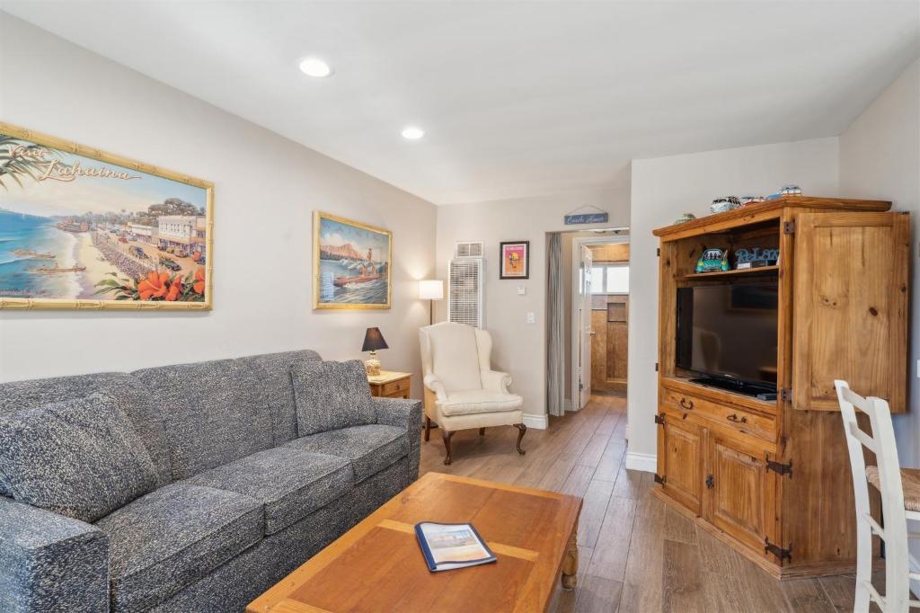 a living room with a couch and a tv at Lovely 1 Bed Beach Condo #128 in Carpinteria