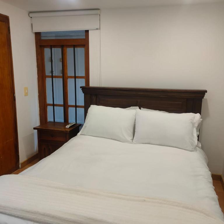Cama o camas de una habitación en Apartaestudios La Candelaria