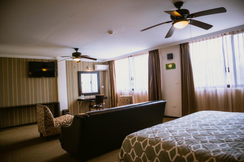 Postel nebo postele na pokoji v ubytování Hotel Clara Luna