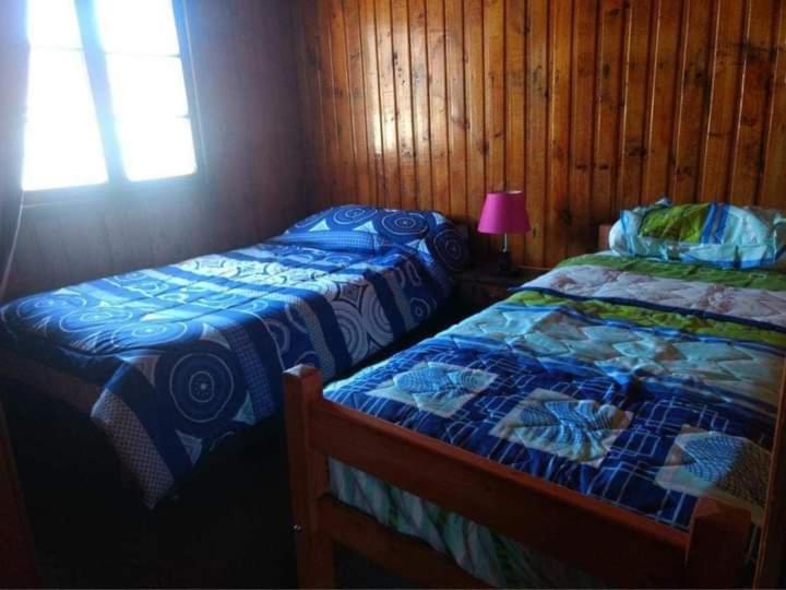 Postel nebo postele na pokoji v ubytování Cabaña nocican