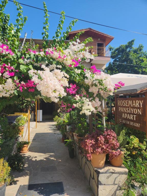 a flower shop with pink and white flowers at Rosemary Kütle pansiyon in Cıralı