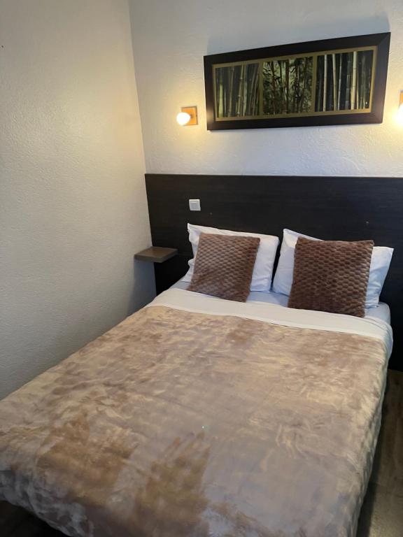 Postel nebo postele na pokoji v ubytování Hotel Clair Logis