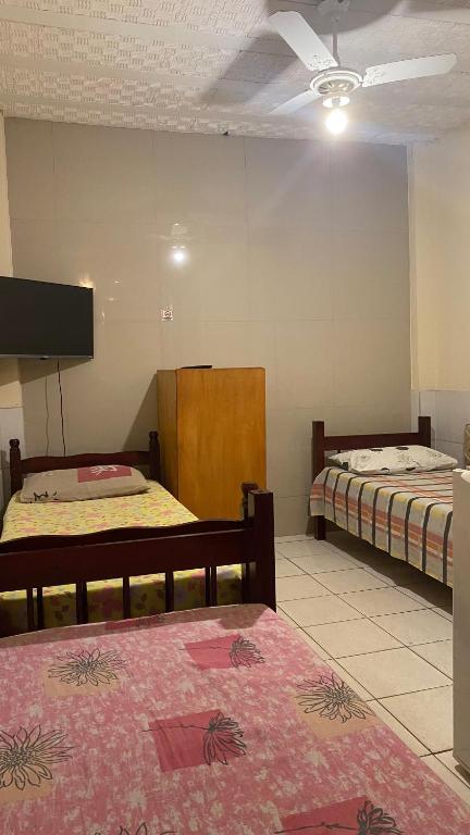 Postel nebo postele na pokoji v ubytování Pousada e Alojamento Engenho de Itaguaí