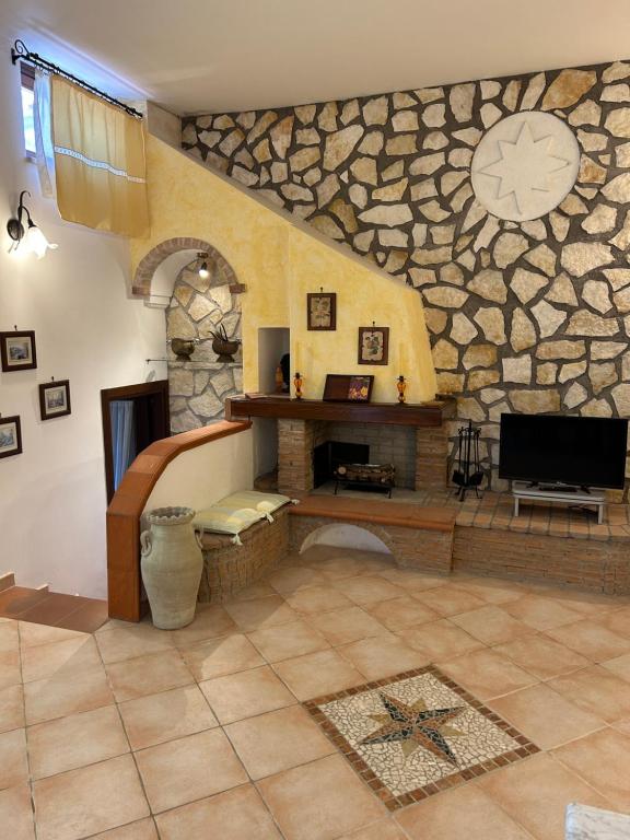 A television and/or entertainment centre at Residenza Antico Borgo del Pozzo