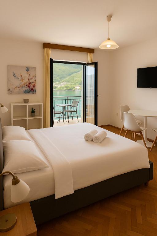 Postel nebo postele na pokoji v ubytování Apartmani More