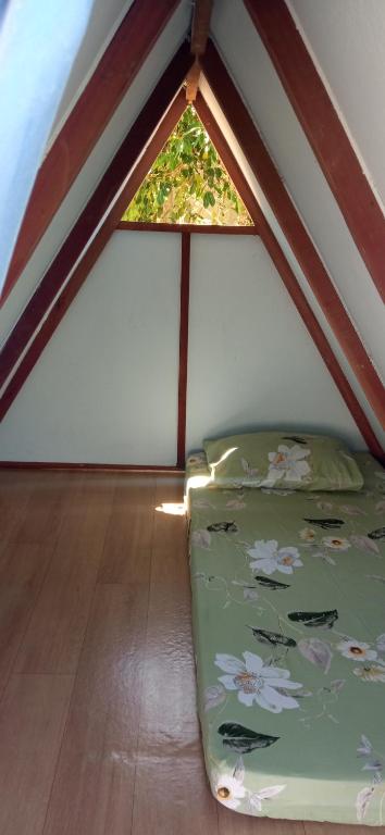 Postel nebo postele na pokoji v ubytování Camping e Pousada Coral do Meio