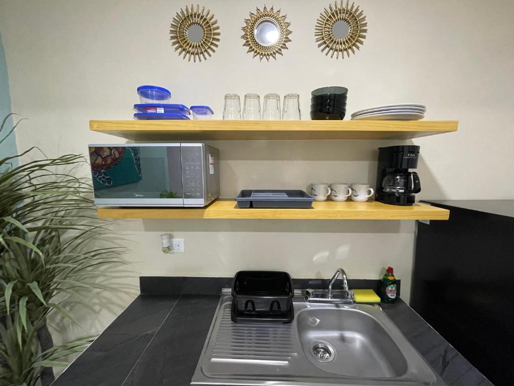 Kuchyň nebo kuchyňský kout v ubytování Casona Suites