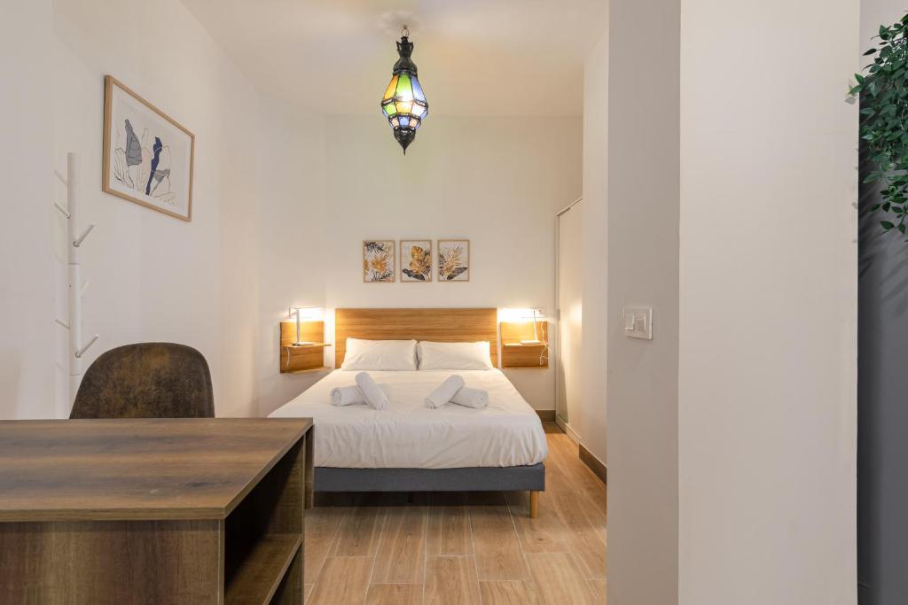 Postel nebo postele na pokoji v ubytování Feria Corner