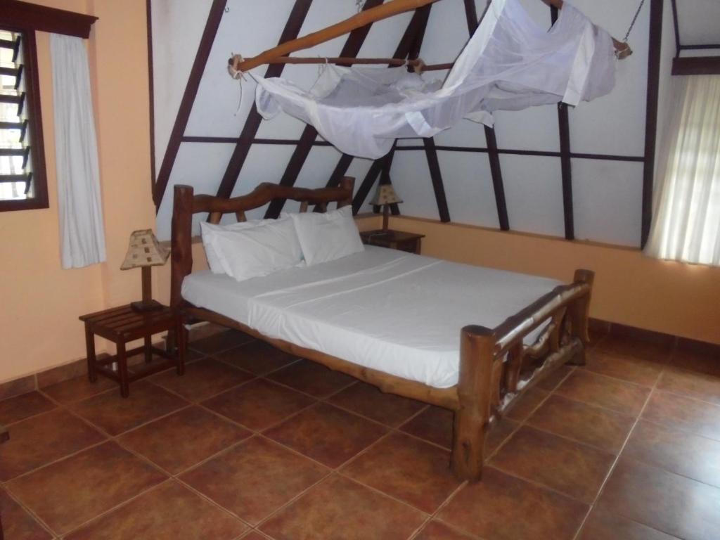 Postel nebo postele na pokoji v ubytování Sunset Villa Boutique Resort