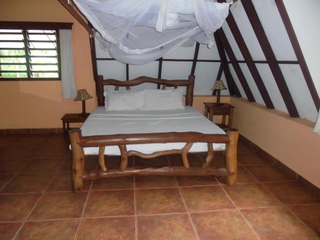 Postel nebo postele na pokoji v ubytování Sunset Villa Boutique Resort