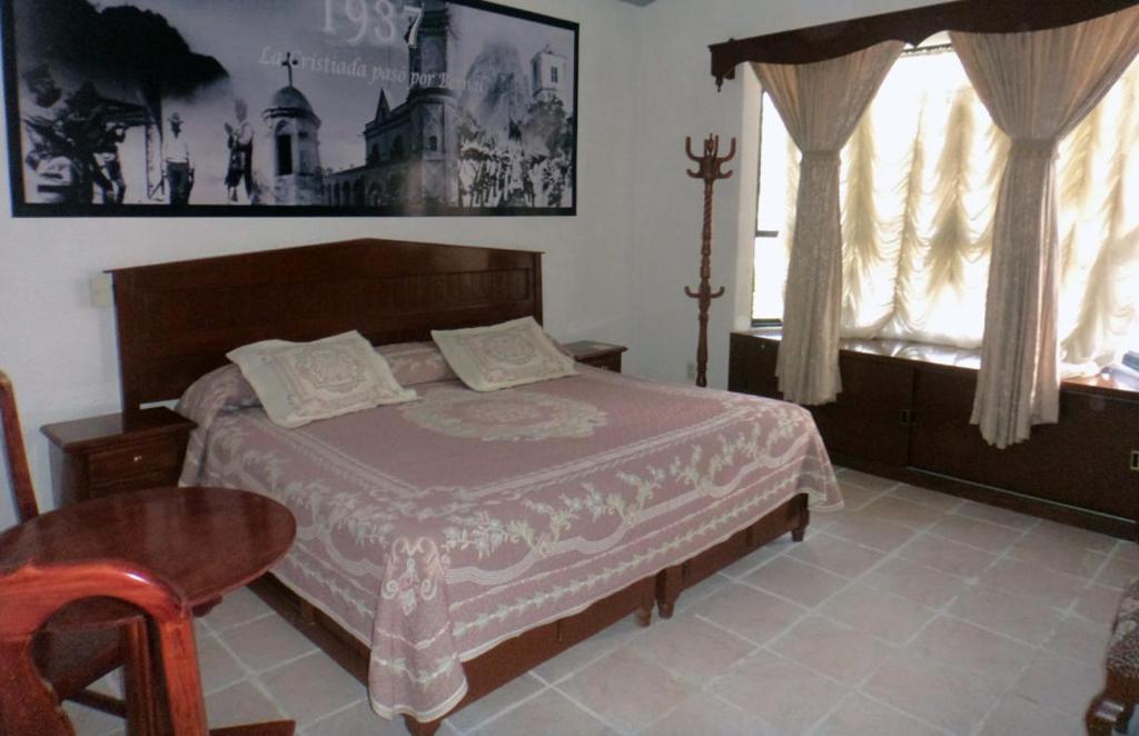 Postel nebo postele na pokoji v ubytování Hotel Don Porfirio