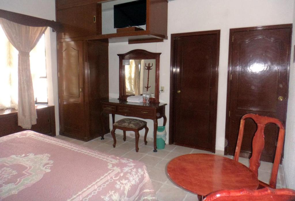 Postel nebo postele na pokoji v ubytování Hotel Don Porfirio