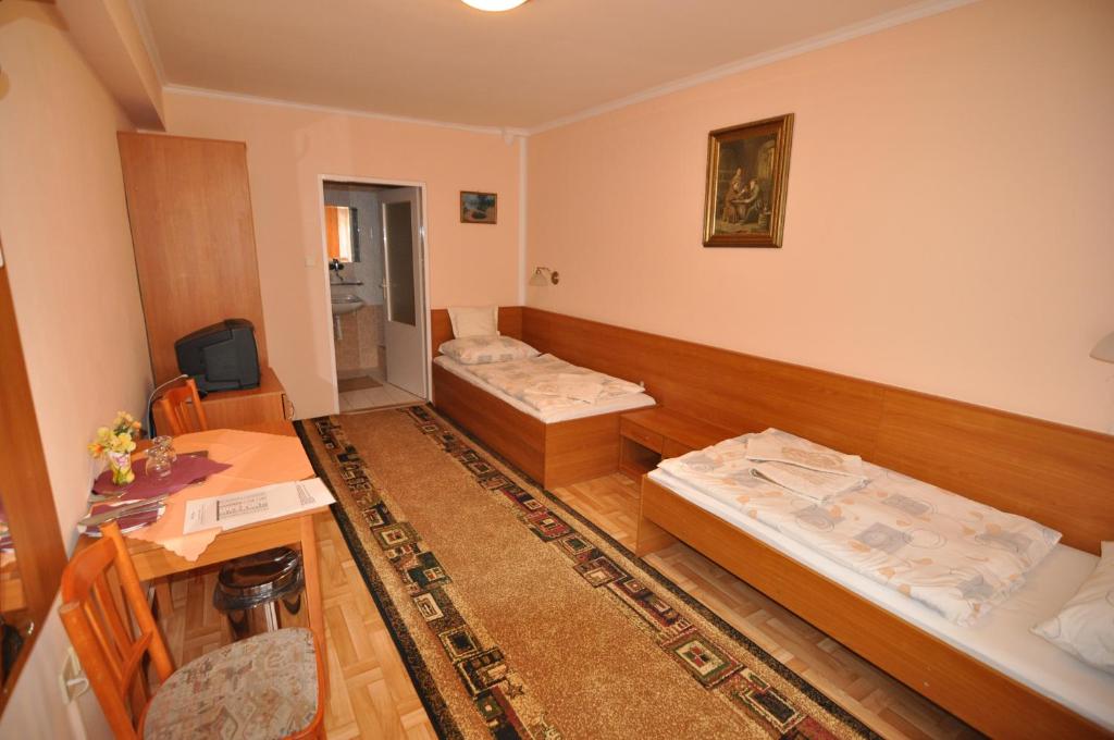 Postel nebo postele na pokoji v ubytování Hotel Átrium