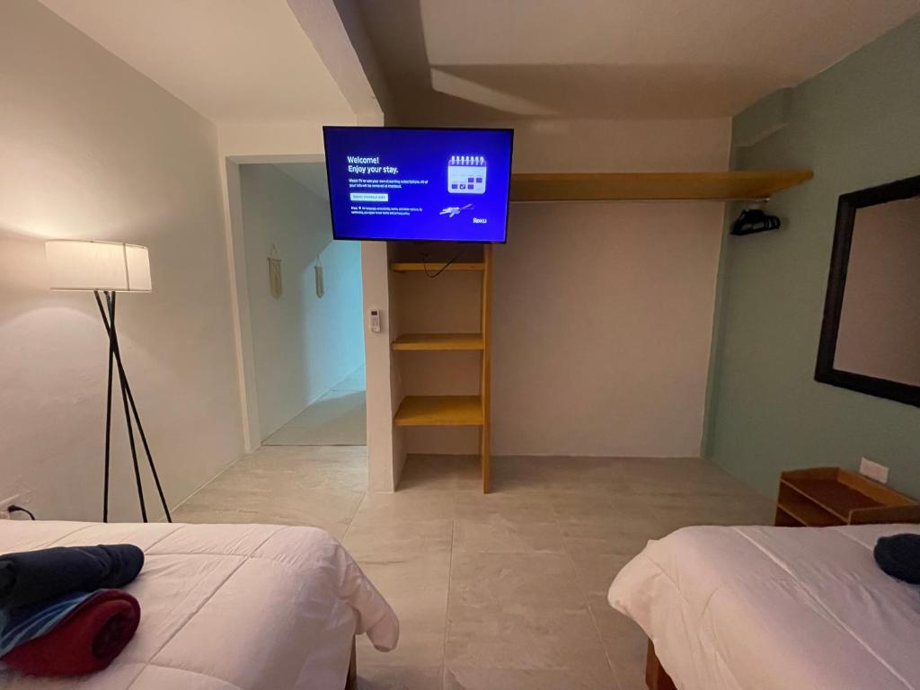 Postel nebo postele na pokoji v ubytování Casona Suites