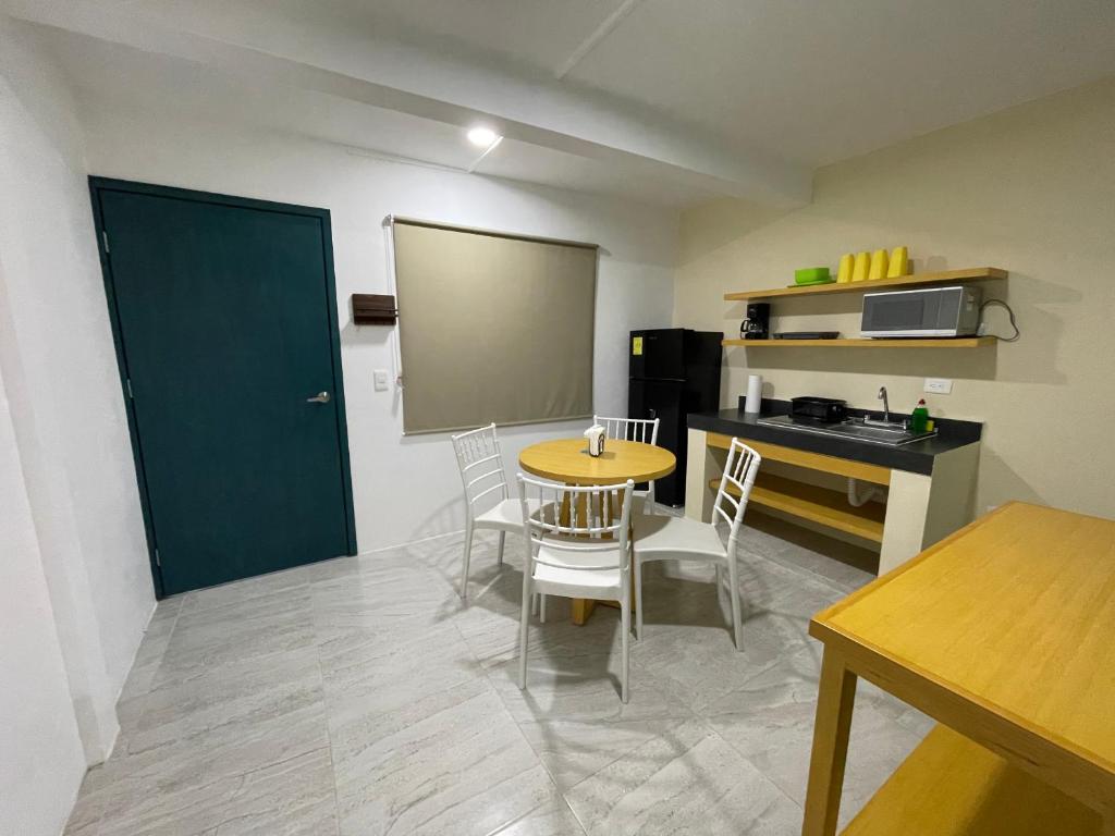 Kuchyň nebo kuchyňský kout v ubytování Casona Suites