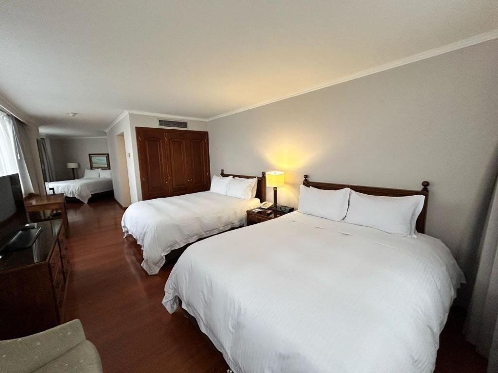 Postel nebo postele na pokoji v ubytování Cosmos 100 Hotel & Centro de Convenciones - Hoteles Cosmos
