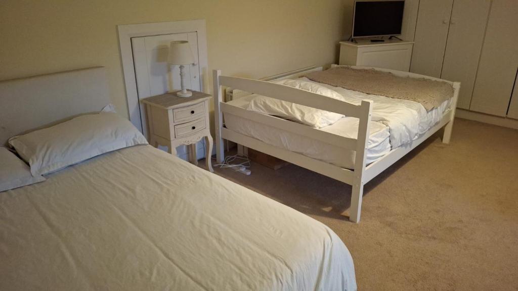 Postel nebo postele na pokoji v ubytování Deeside Manor