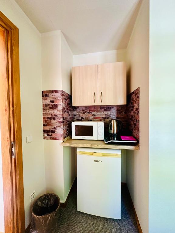 Kuchyň nebo kuchyňský kout v ubytování Express Guest House