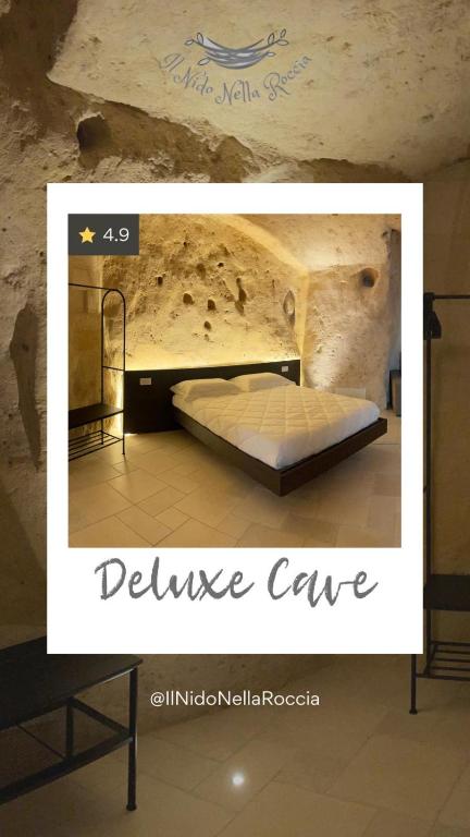 a picture of a bed in a cave at IL Nido nella Roccia in Matera