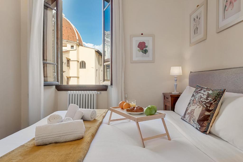 Ένα ή περισσότερα κρεβάτια σε δωμάτιο στο GOLDEN LUXE - 2 camere con vista sul Duomo