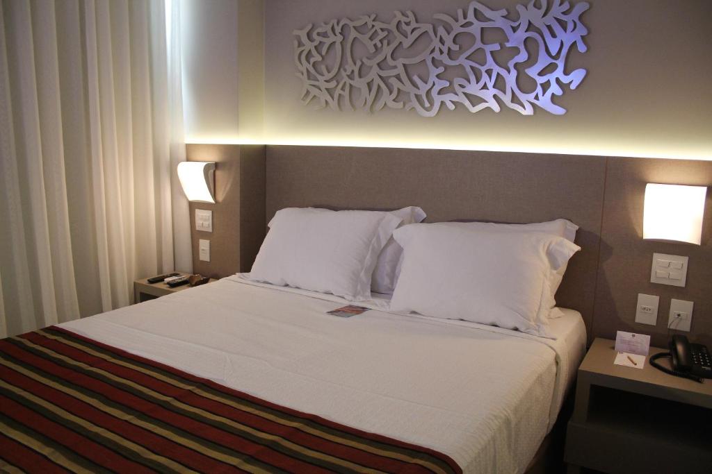 Cama ou camas em um quarto em Hotel Beaga Convention Expominas by MHB