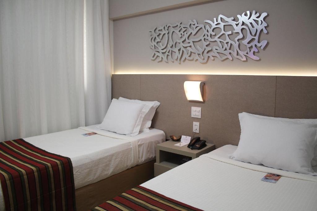 Cama ou camas em um quarto em Hotel Beaga Convention Expominas by MHB