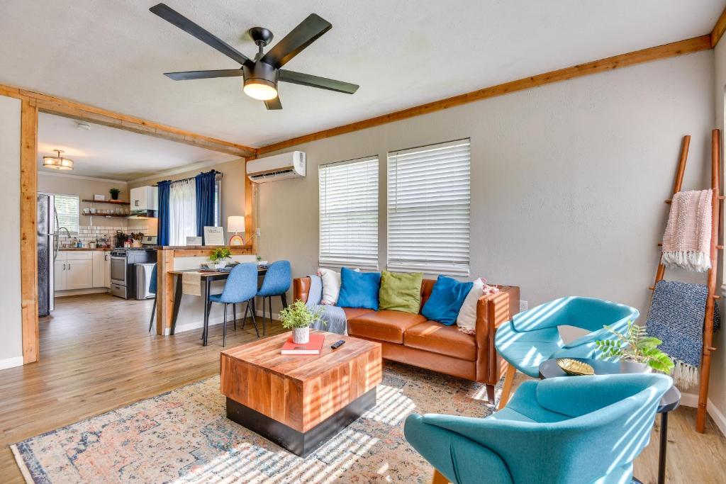 a living room with a couch and chairs and a table at 5 Mi to Dtwn Tulsa Pet-Friendly Home! in Tulsa
