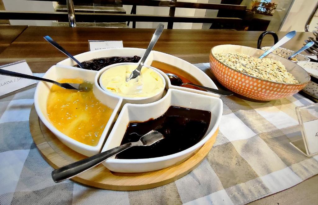 a table with two bowls of food on a table at Scala 68 in Bogotá