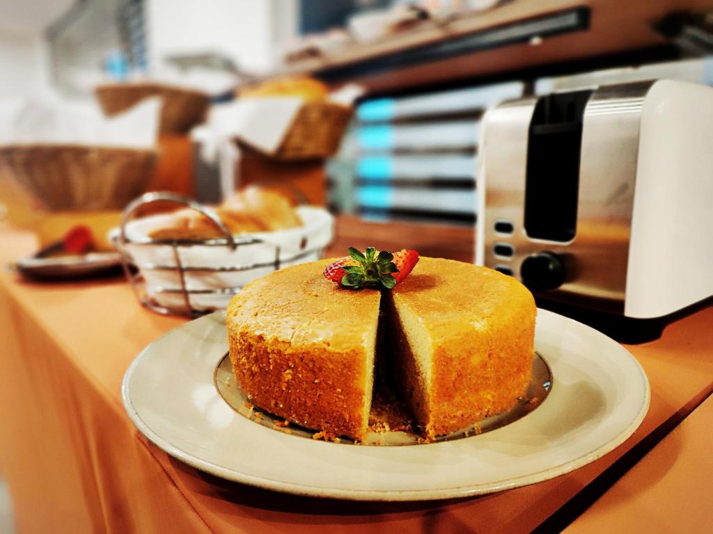 a piece of cake on a counter in a kitchen at Scala 68 in Bogotá
