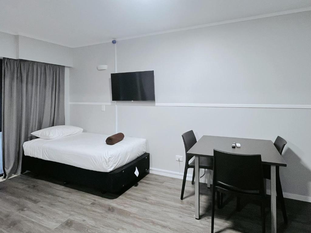 Postel nebo postele na pokoji v ubytování Beetham Park Motel
