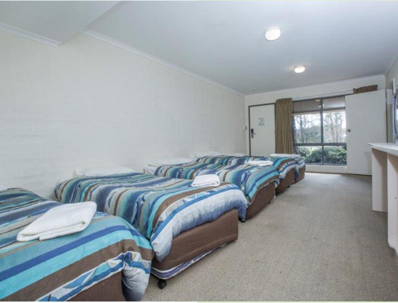 
Dormitory Room with Seven Single Beds
