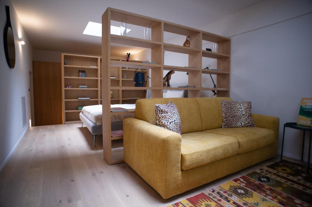 a living room with a couch and a bed at Varanini Luxury Suites double bedroom plus two and sauna in Milan