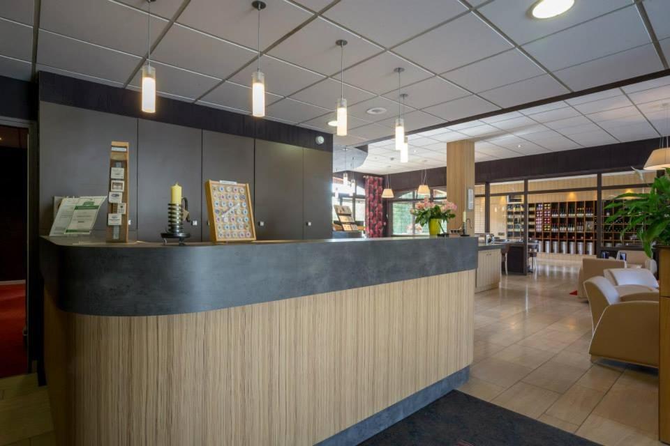 a lobby with a counter in a store at Hostellerie St Vincent in Nuits-Saint-Georges