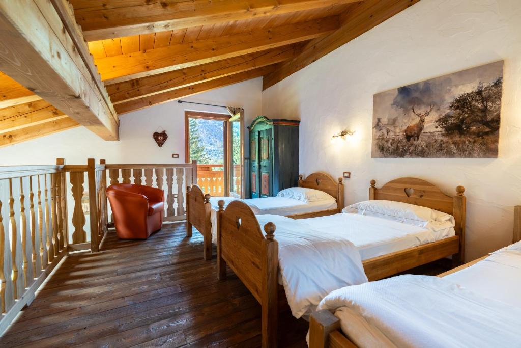 Postel nebo postele na pokoji v ubytování Bijoux Des Alpes - Mont Blanc Village