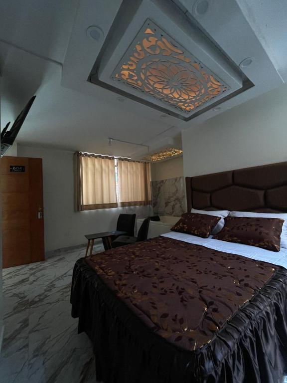 Katil atau katil-katil dalam bilik di Hostal El Encanto