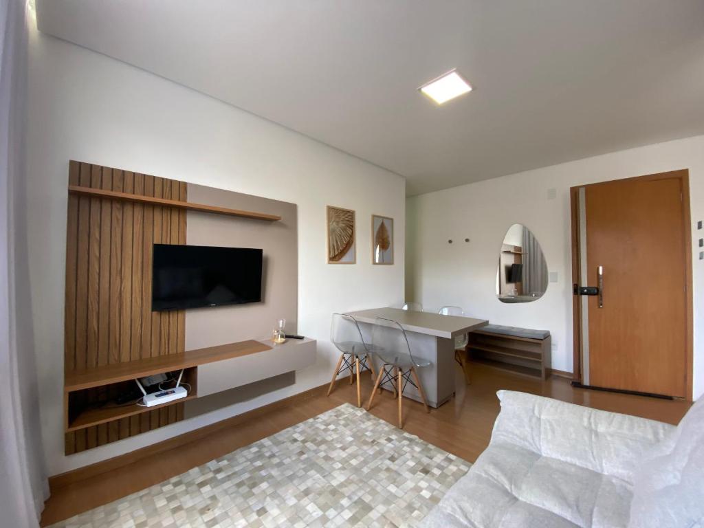 Et tv og/eller underholdning på Apartamento com ar condicionado no Bairro Cabral