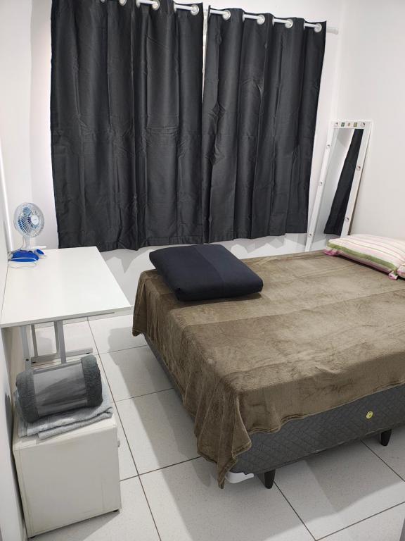 Ένα ή περισσότερα κρεβάτια σε δωμάτιο στο Apartamento 01 quarto cama casal com wi-fi