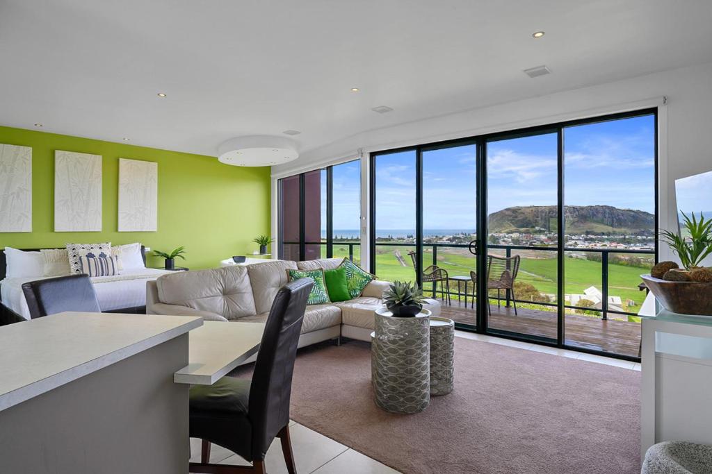 a living room with a couch and a table at Horizon Deluxe Apartments in Stanley