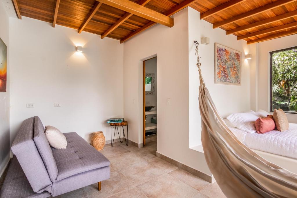 Postel nebo postele na pokoji v ubytování Serendipity Hospedaje Boutique