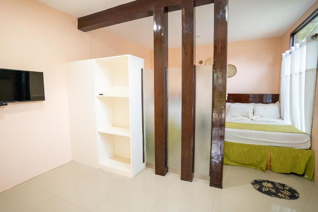 Postel nebo postele na pokoji v ubytování AltaVista Beach Resort Samal powered by Cocotel