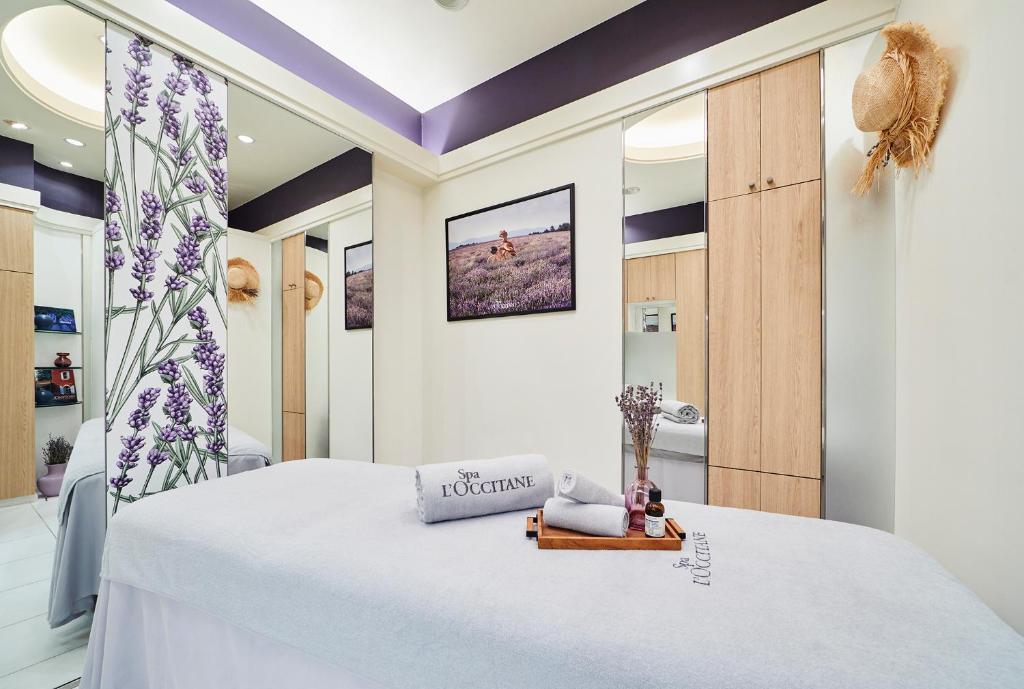 Postel nebo postele na pokoji v ubytování Royal Park Hotel
