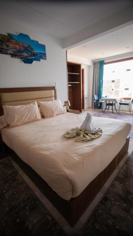 Postel nebo postele na pokoji v ubytování Giza pyramids hotel
