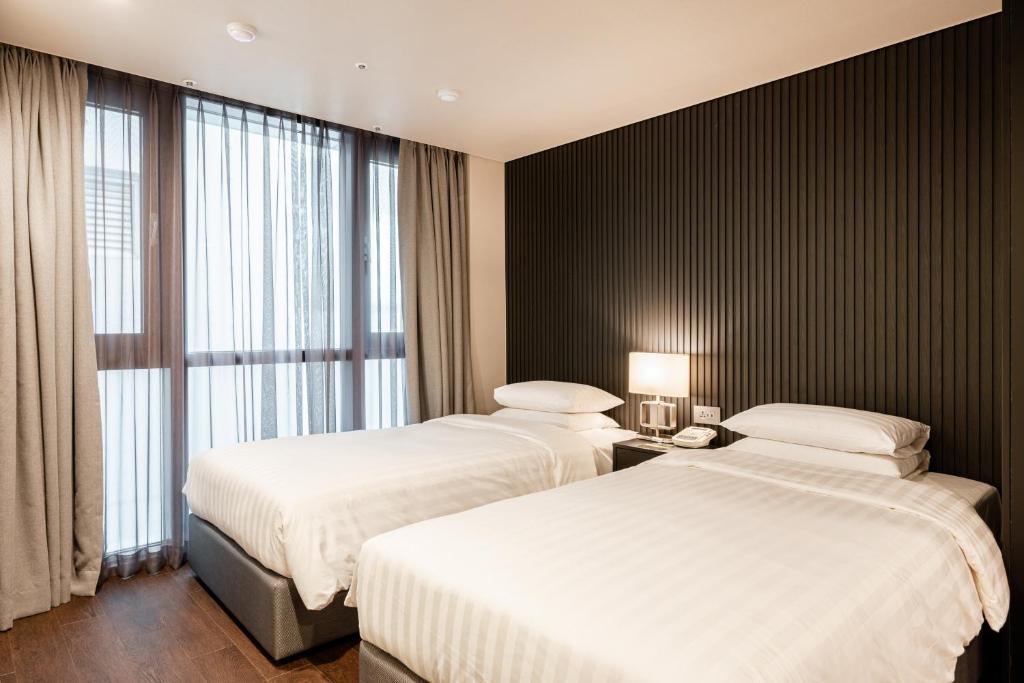 Postel nebo postele na pokoji v ubytování Haeundae Centum Hotel