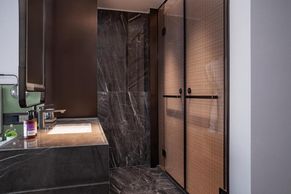 Koupelna v ubytování 义乌君忆云澜国际酒店 Yiwu Junyi Yunlan International Hotel