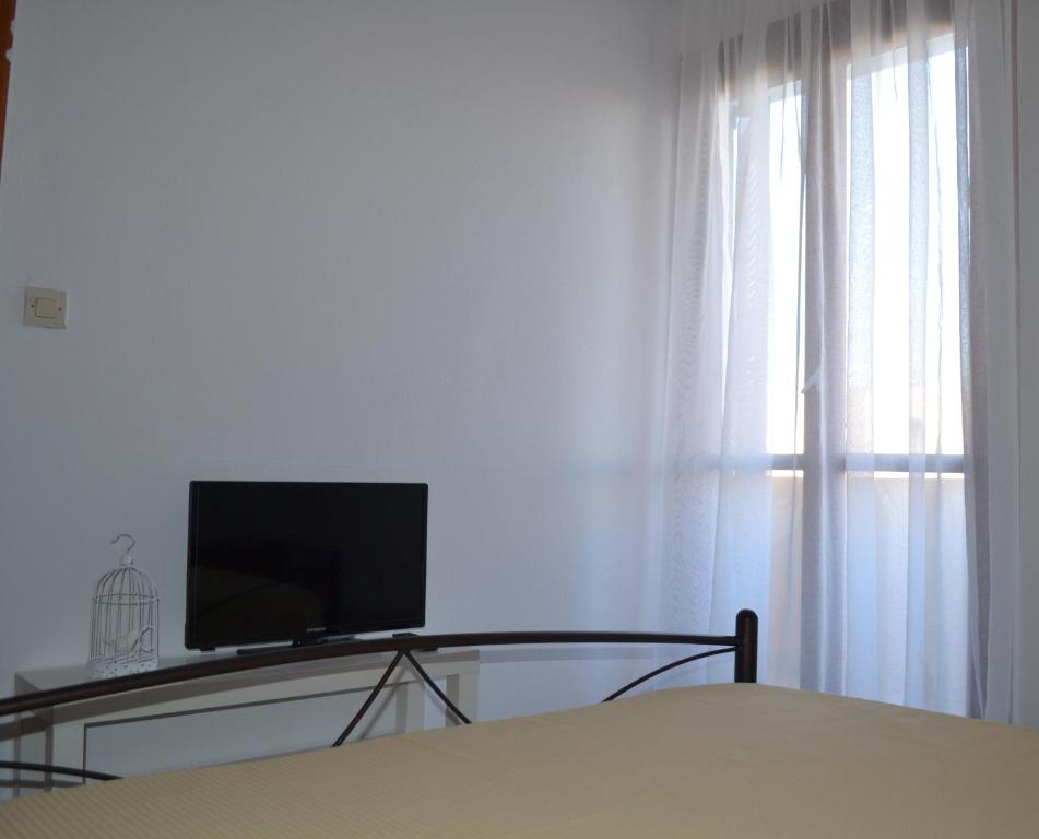TV a/nebo společenská místnost v ubytování Floralia
