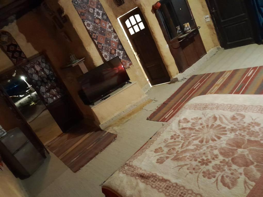 Postel nebo postele na pokoji v ubytování Giza Oasis Ein Koudra