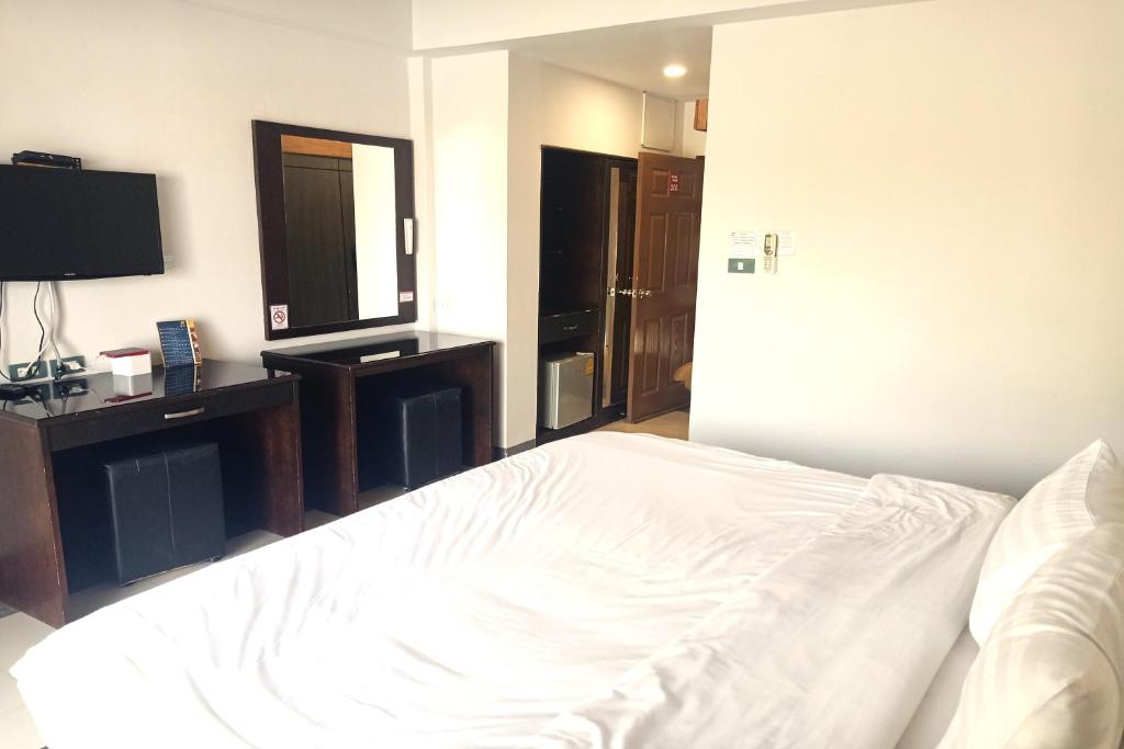 Postel nebo postele na pokoji v ubytování Smile Place Hotel Chiang Rai