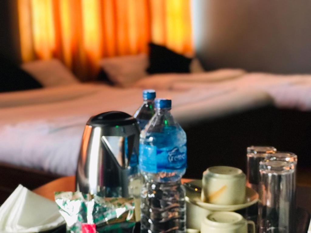 Postel nebo postele na pokoji v ubytování Mita Hotel